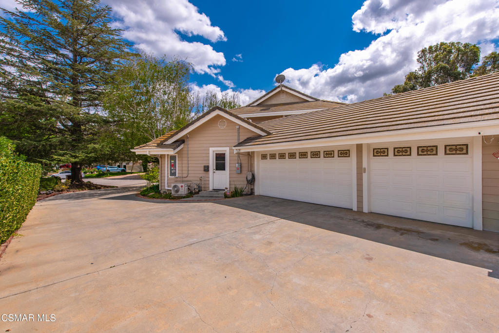 206 Rangely Court Simi Valley, CA 93065 - Photo 51 of 63 a view of a white house with a large tree