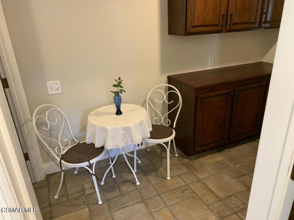 206 Rangely Court Simi Valley, CA 93065 - Photo 57 of 63 a table and chairs in a kitchen