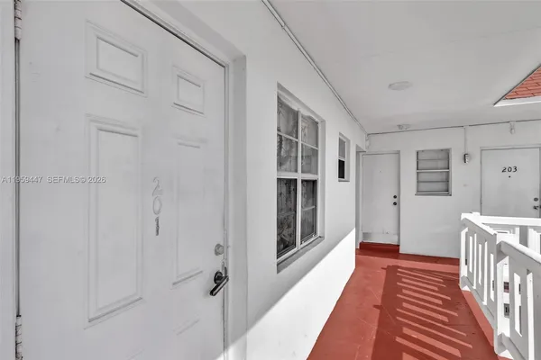 a view of a swimming pool with outdoor seating