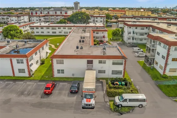 an aerial view of residential building and ocean view