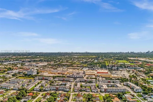 an aerial view of residential building with ocean view