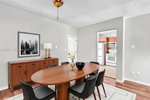 a view of a dining room with furniture and wooden floor