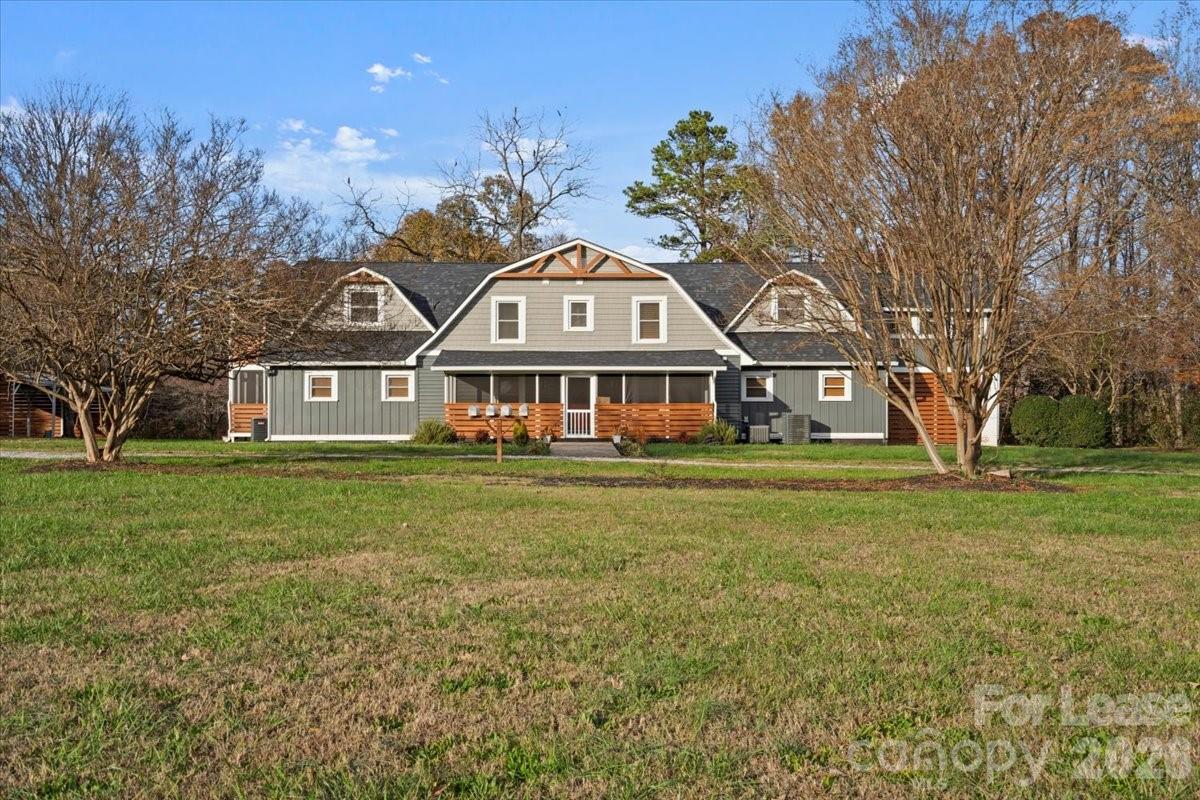 2708 Mooresville Road, Unit B Salisbury, NC 28147 - Photo 1 of 11 a front view of a house with a garden