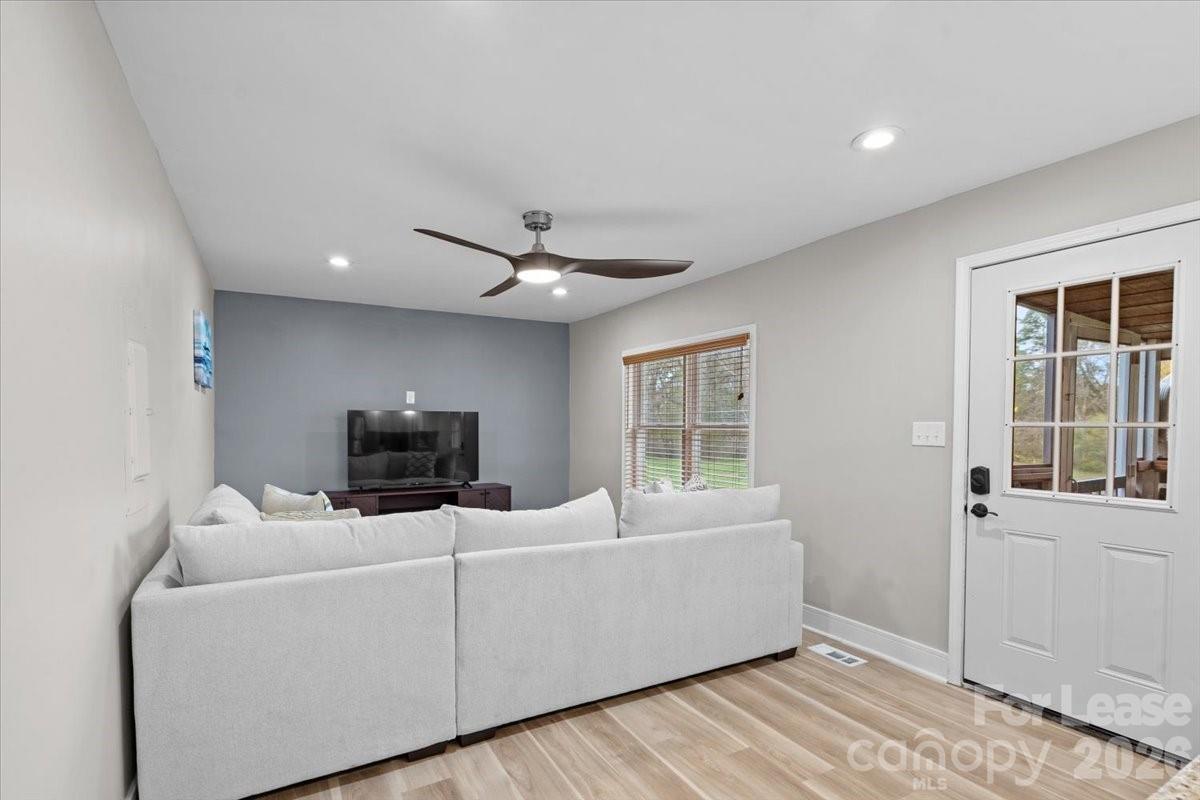 2708 Mooresville Road, Unit B Salisbury, NC 28147 - Photo 5 of 11 a living room with furniture and a flat screen tv