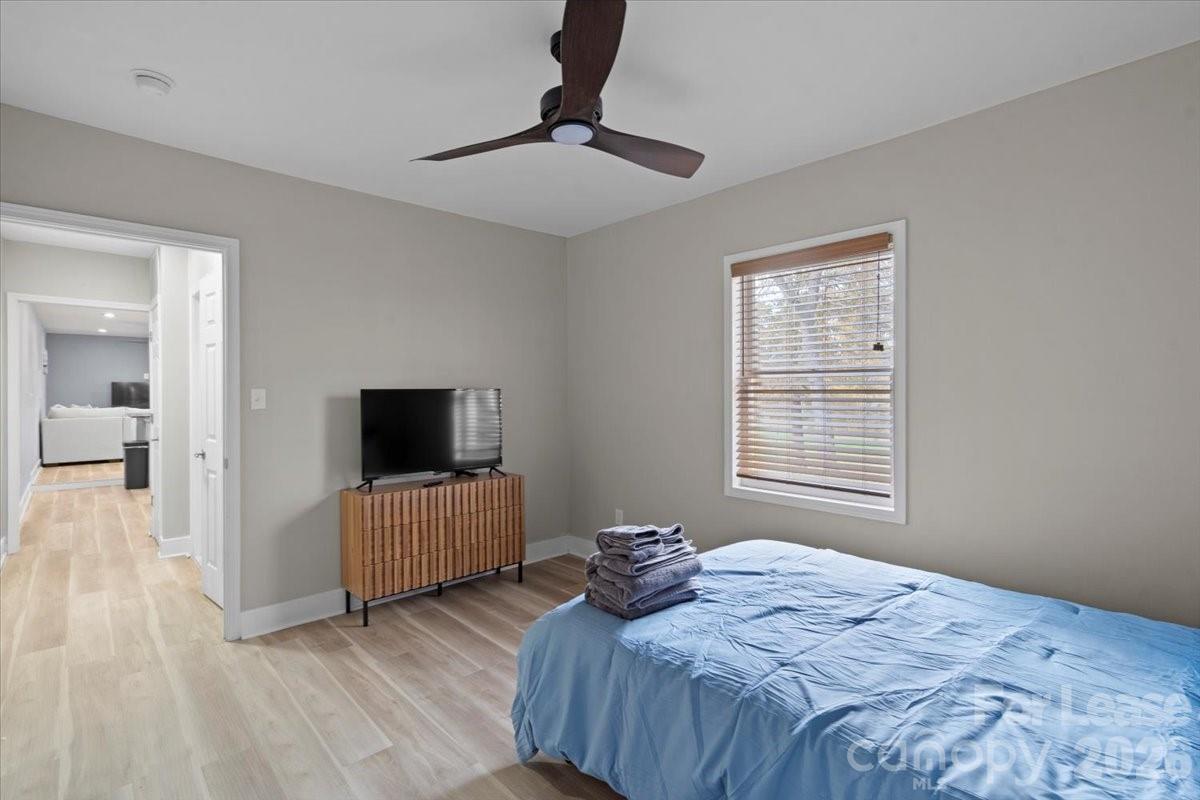 2708 Mooresville Road, Unit B Salisbury, NC 28147 - Photo 7 of 11 a bedroom with a bed and a television