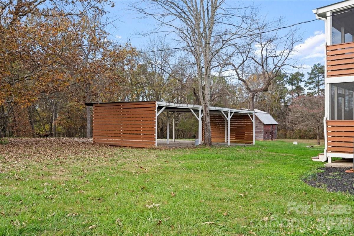2708 Mooresville Road, Unit B Salisbury, NC 28147 - Photo 9 of 11 a view of a house with a yard
