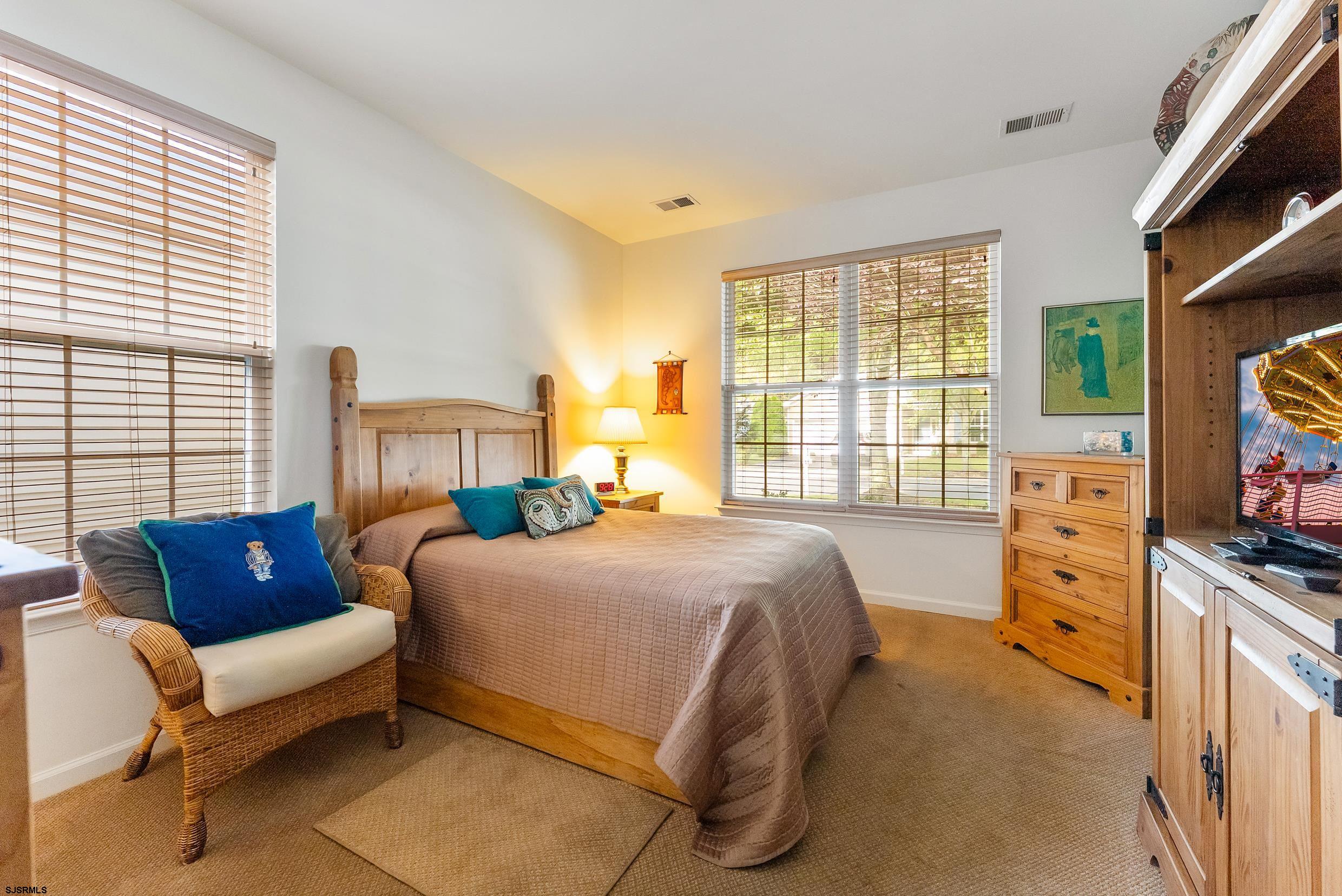 4 Northampton Road Smithville, NJ 08205 - Photo 28 of 39 a bedroom with a bed and a dresser