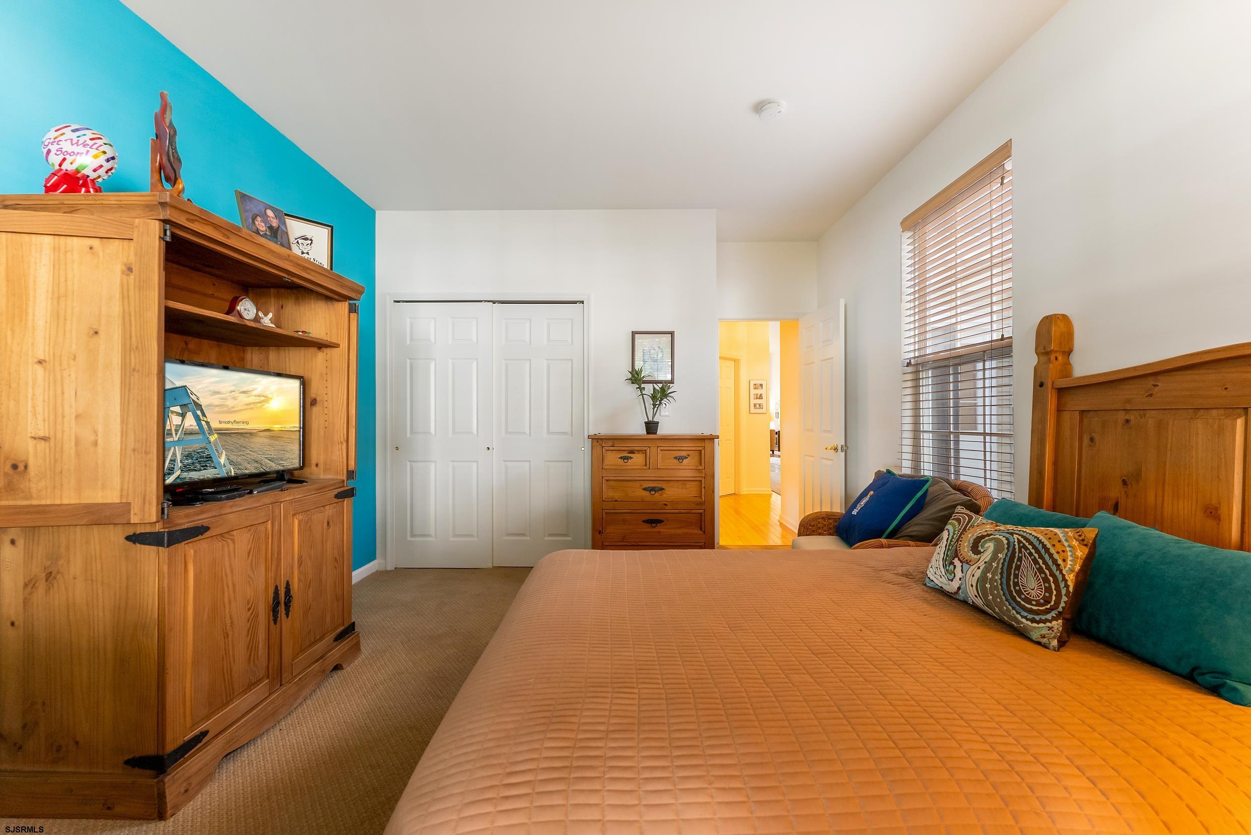 4 Northampton Road Smithville, NJ 08205 - Photo 29 of 39 a bedroom with a bed and a flat screen tv