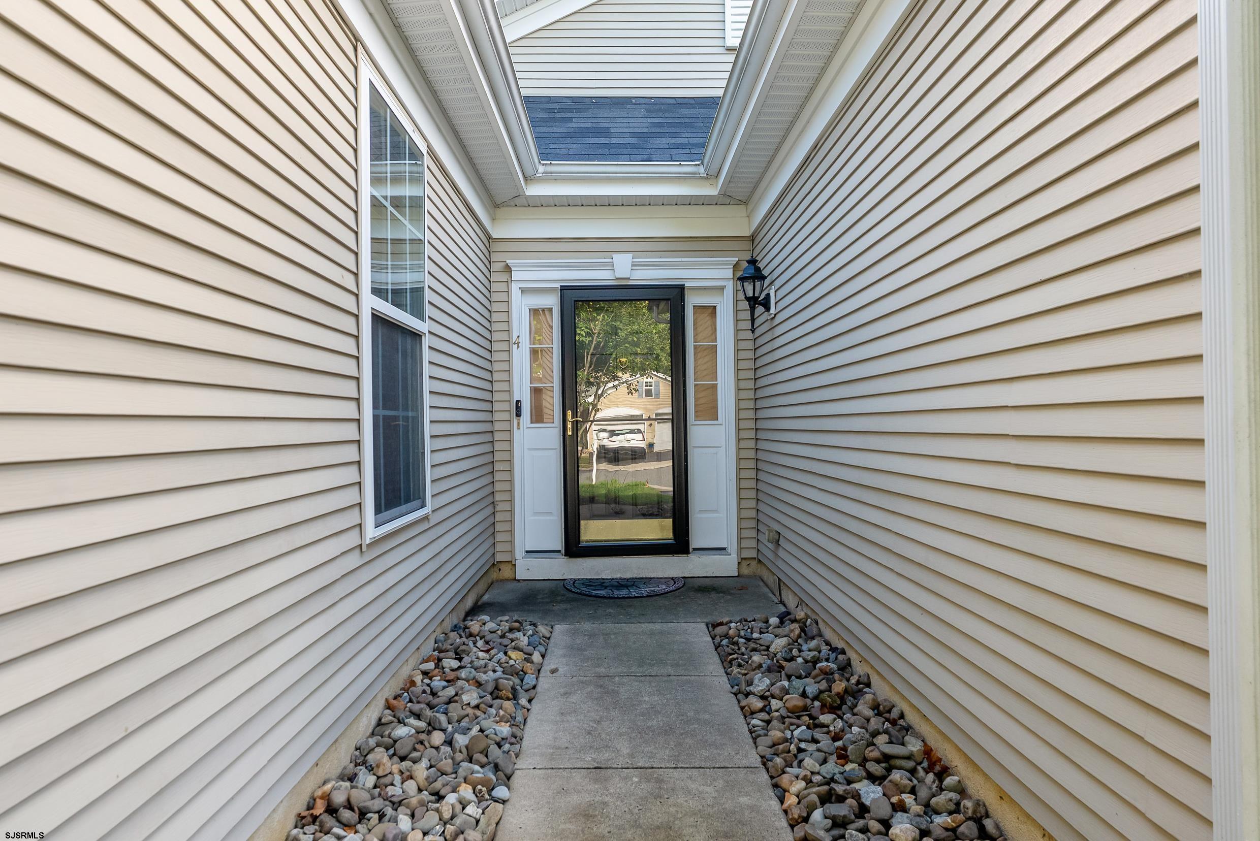 4 Northampton Road Smithville, NJ 08205 - Photo 4 of 39 a view of a house with a door and a window