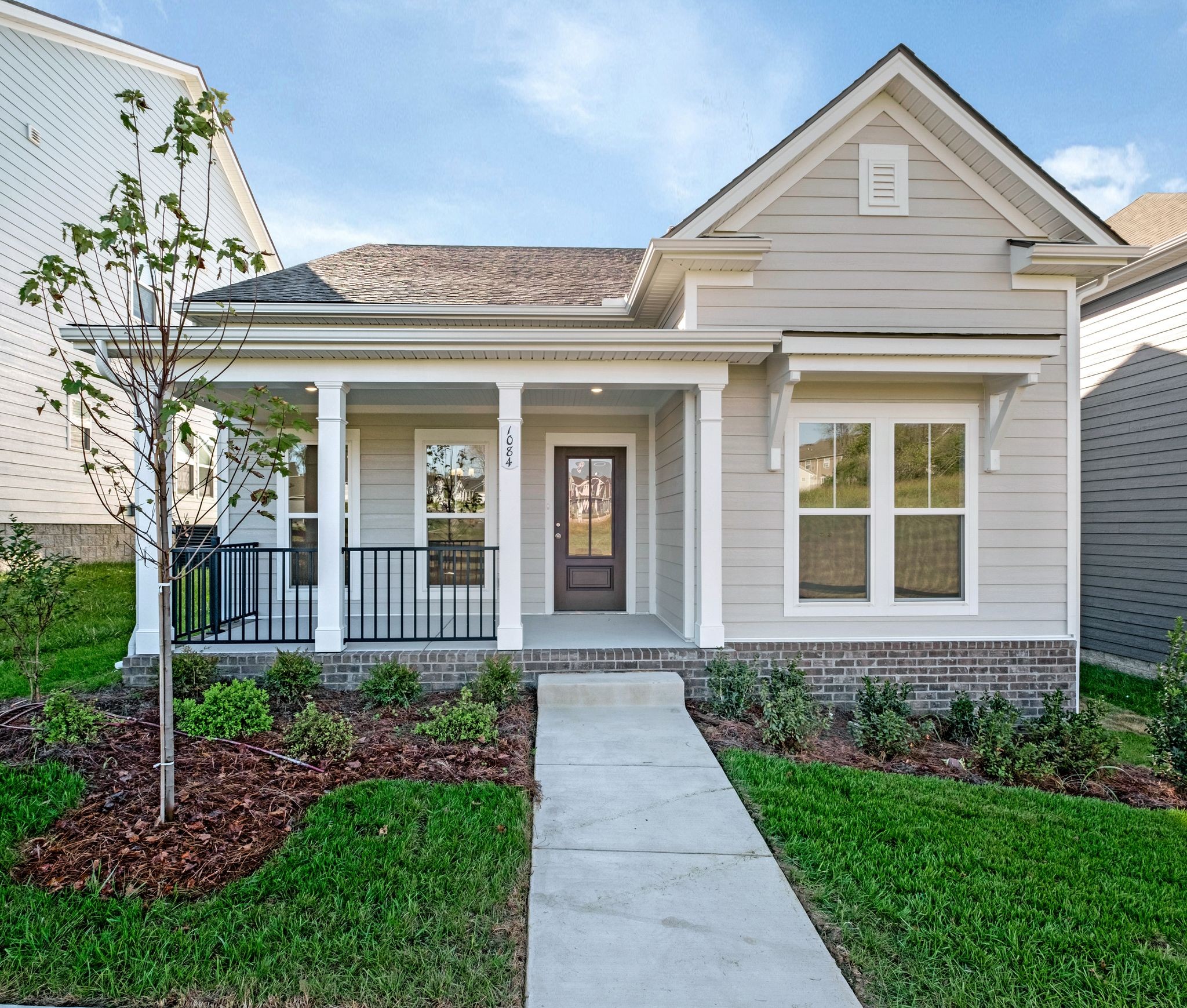 7321 Carothers Road Nolensville, TN 37135 - Photo 1 of 32 a front view of a house with garden