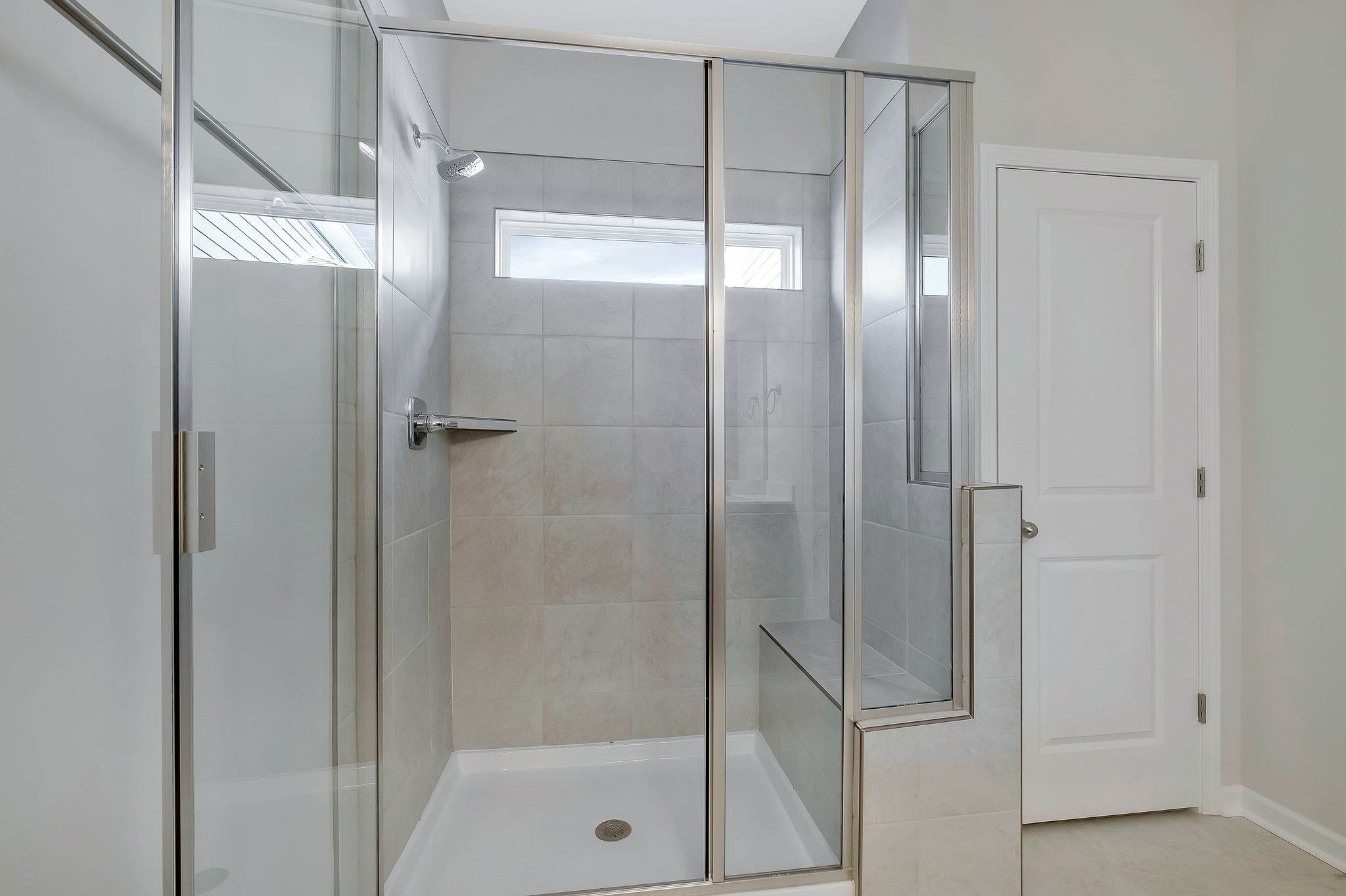 7321 Carothers Road Nolensville, TN 37135 - Photo 15 of 32 a bathroom with a glass shower door