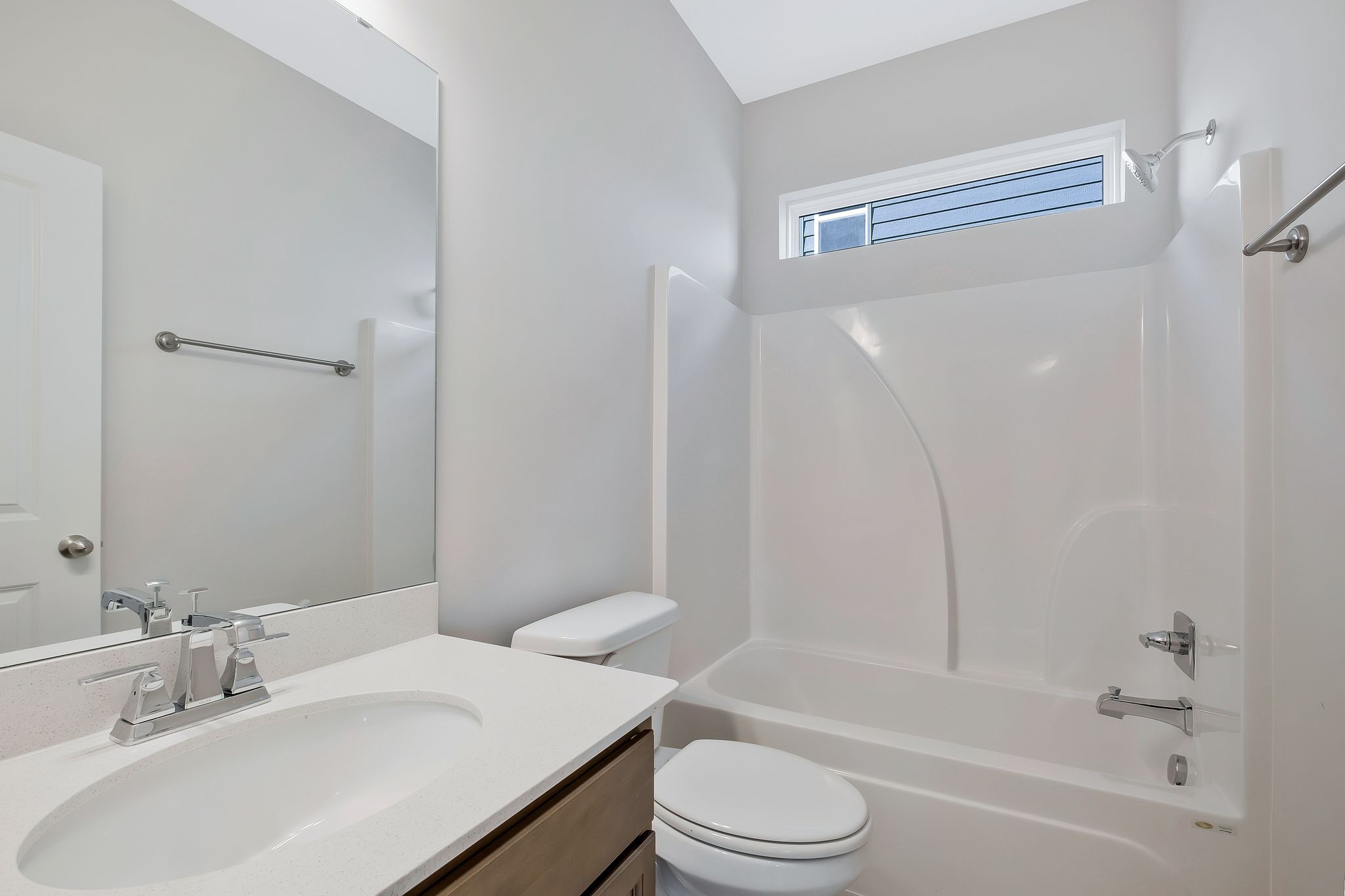 7321 Carothers Road Nolensville, TN 37135 - Photo 18 of 32 a bathroom with a bathtub shower sink vanity mirror and toilet