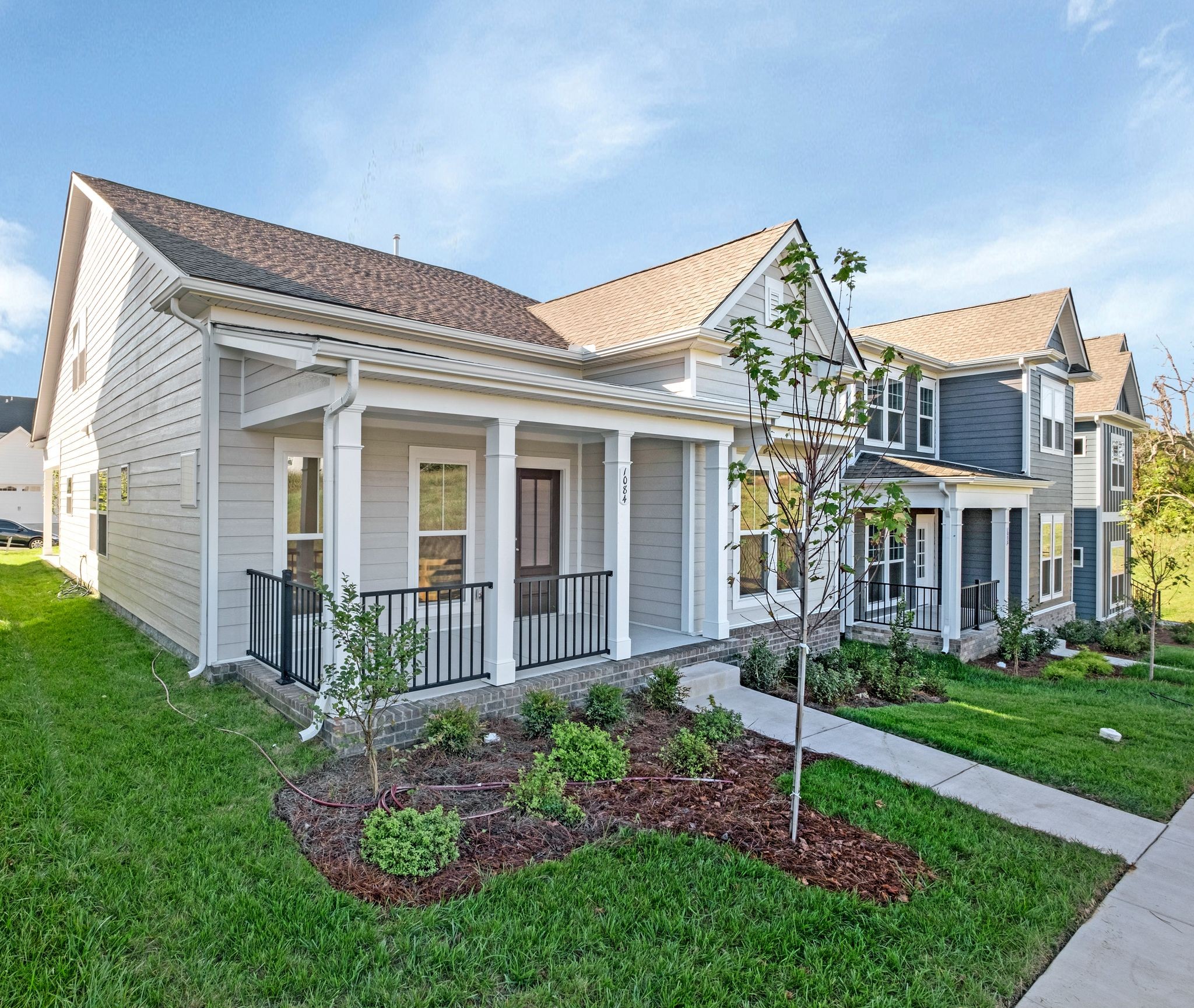 7321 Carothers Road Nolensville, TN 37135 - Photo 2 of 32 a front view of a house with garden