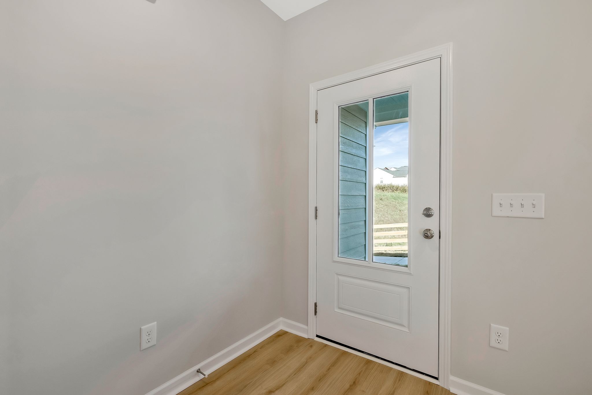 7321 Carothers Road Nolensville, TN 37135 - Photo 6 of 32 a view of an empty room with wooden floor and a window