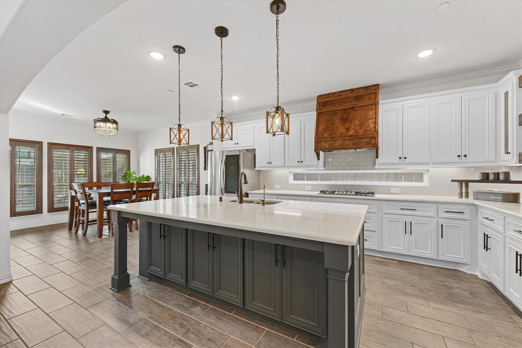 7720 Falcon Ridge Road Denton, TX 76208 - Photo 11 of 38 Oversized island for the perfect eat in spot