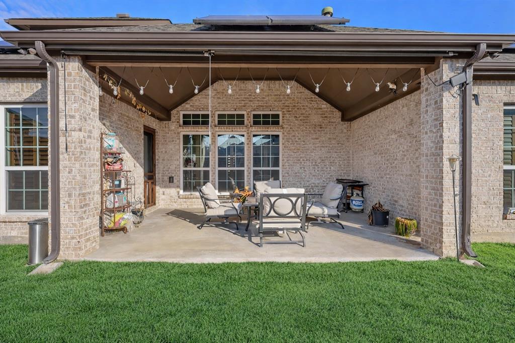 7720 Falcon Ridge Road Denton, TX 76208 - Photo 33 of 38 Covered back patio perfect for hosting