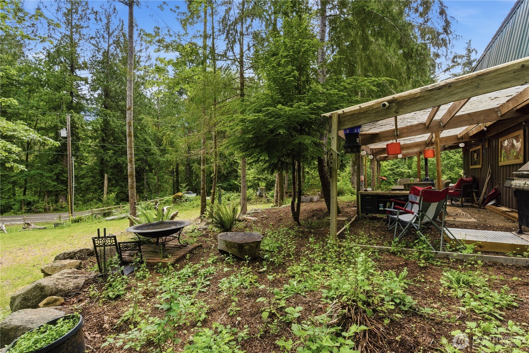 3320 Duckabush Road Brinnon, WA 98320 - Photo 23 of 38 a view of backyard with swimming pool and sitting area