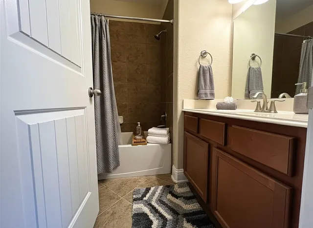 a bathroom with a double vanity sink a toilet and a mirror