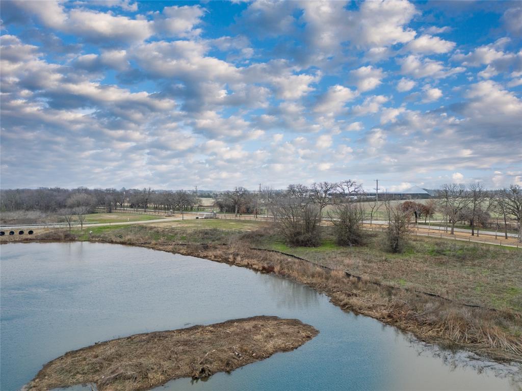 1021 Willow Point Oak Point, TX 75068 - Photo 18 of 22 a view of a lake with a yard