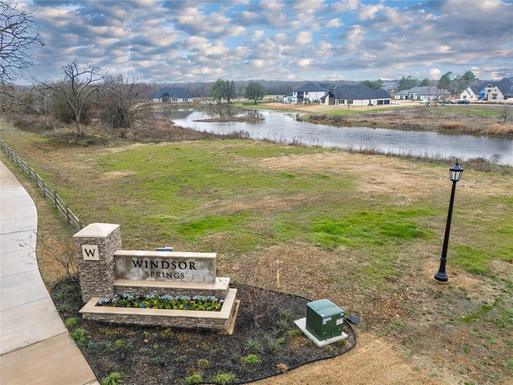 1021 Willow Point Oak Point, TX 75068 - Photo 9 of 22 a view of a water fountain with large trees