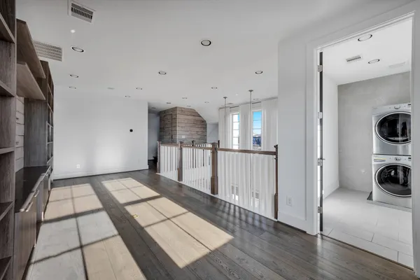 a view of kitchen with refrigerator and cabinets