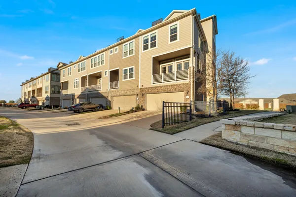 a view of a car parked in front of a building
