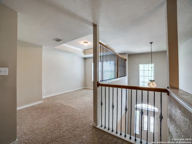 a view of hallway with windows