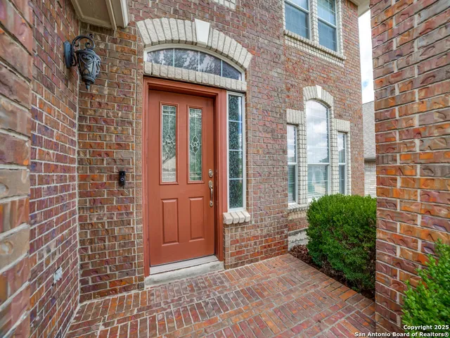 a view of a brick building with many windows