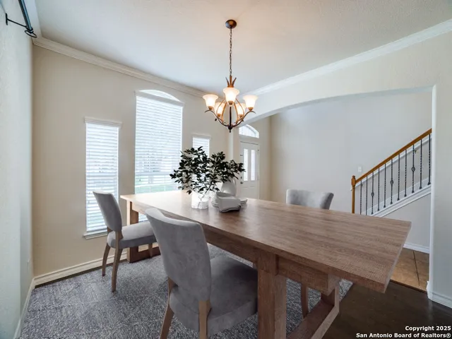 a view of a dining room with furniture and window