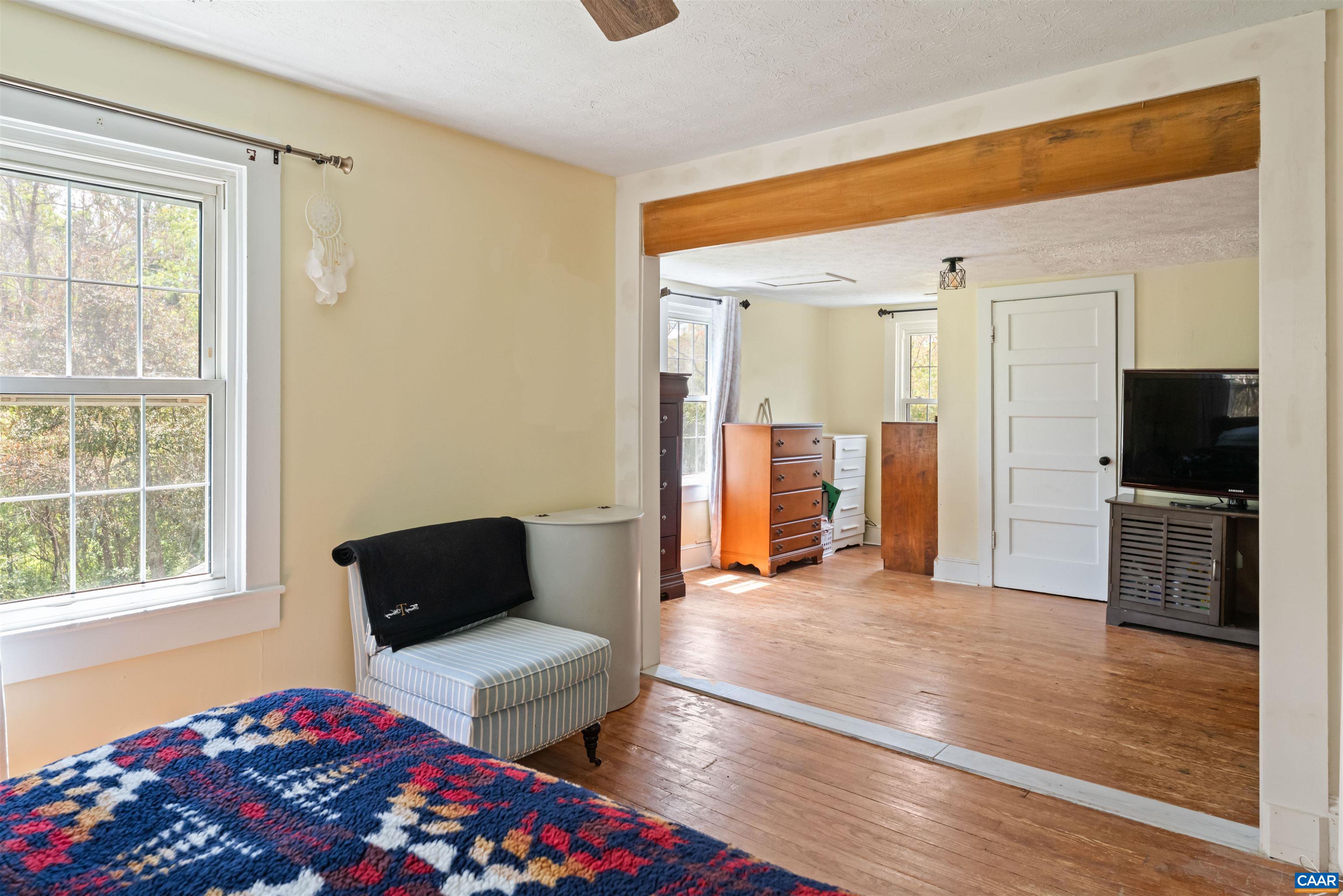 418 James River Road Scottsville, VA 24590 - Photo 23 of 61 a bedroom with a bed and a television