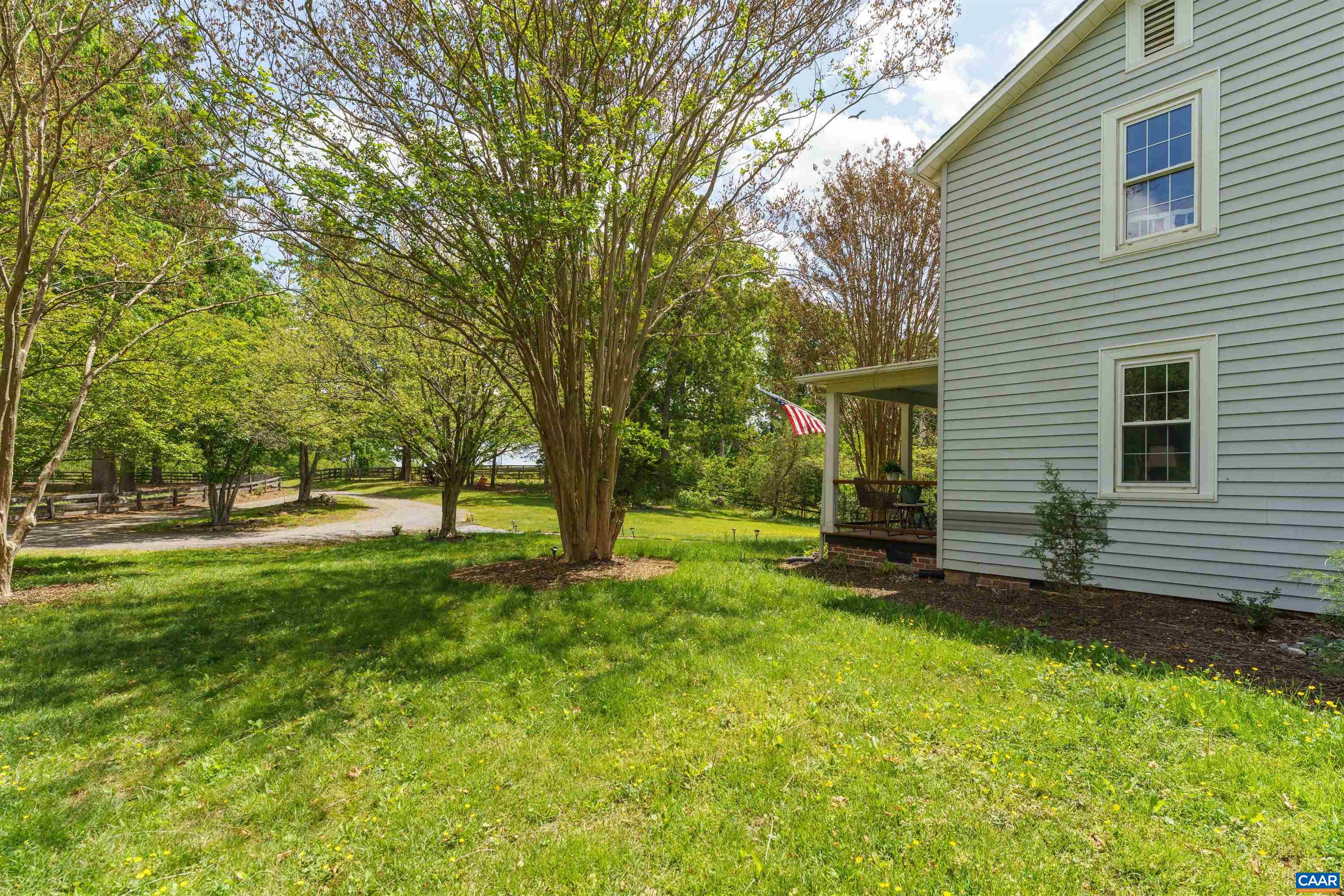 418 James River Road Scottsville, VA 24590 - Photo 32 of 61 a view of a backyard with a large tree