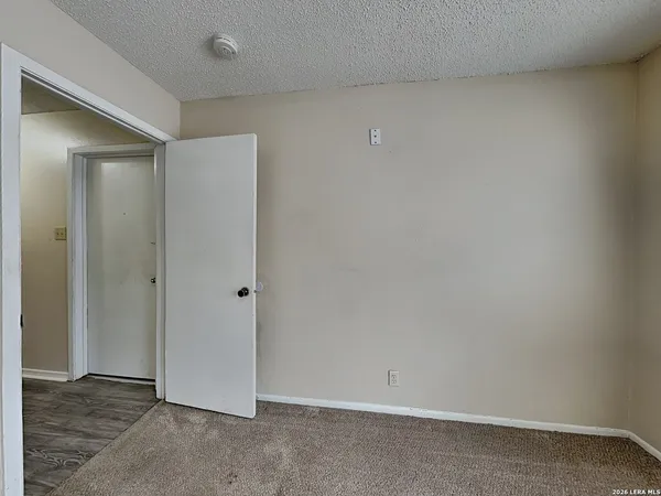 a bathroom with a sink mirror vanity and toilet