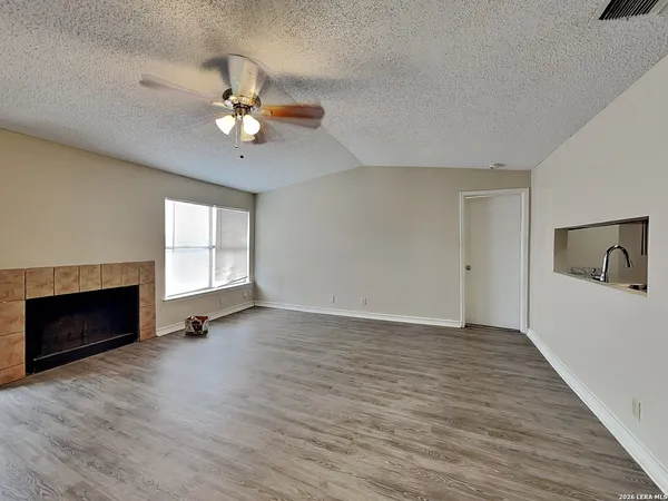 a view of a livingroom with wooden floor
