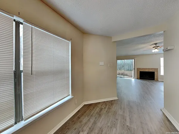 a kitchen with granite countertop a stove and a microwave