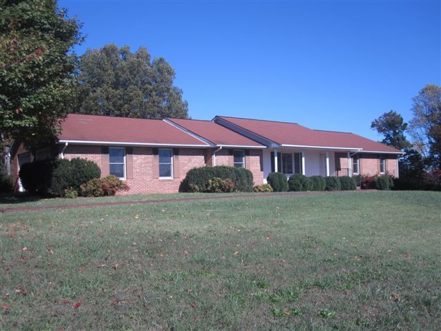 3778 Callaway Road Rocky Mount, VA 24151 - Photo 1 of 28 a front view of a house with garden