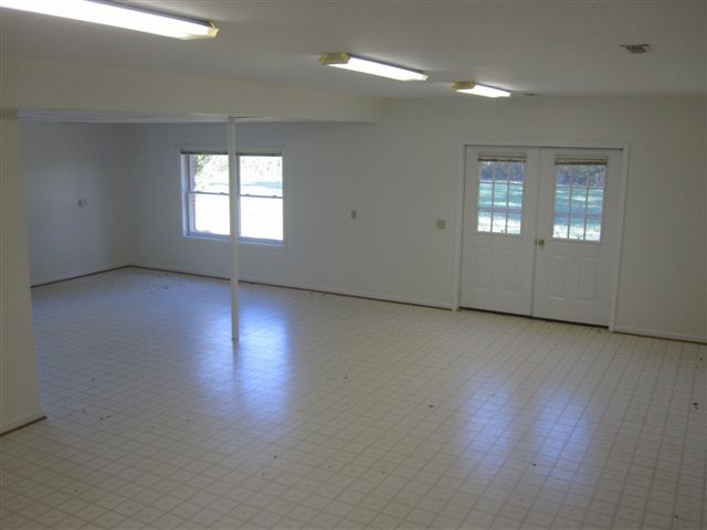 3778 Callaway Road Rocky Mount, VA 24151 - Photo 15 of 28 an empty room with wooden floor and windows