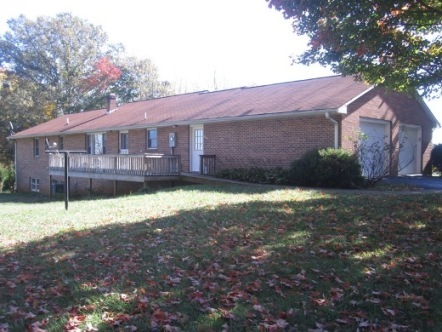 3778 Callaway Road Rocky Mount, VA 24151 - Photo 25 of 28 a view of a house with a yard and a large tree