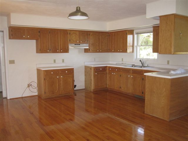 3778 Callaway Road Rocky Mount, VA 24151 - Photo 5 of 28 a kitchen with stainless steel appliances granite countertop a sink a stove counter space and wooden floor
