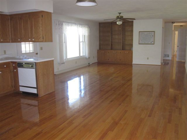 3778 Callaway Road Rocky Mount, VA 24151 - Photo 6 of 28 a kitchen with granite countertop white cabinets and wooden floor