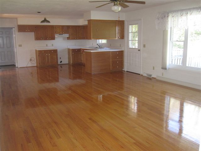 3778 Callaway Road Rocky Mount, VA 24151 - Photo 7 of 28 a view of a kitchen with a sink hardwood floor and a living room