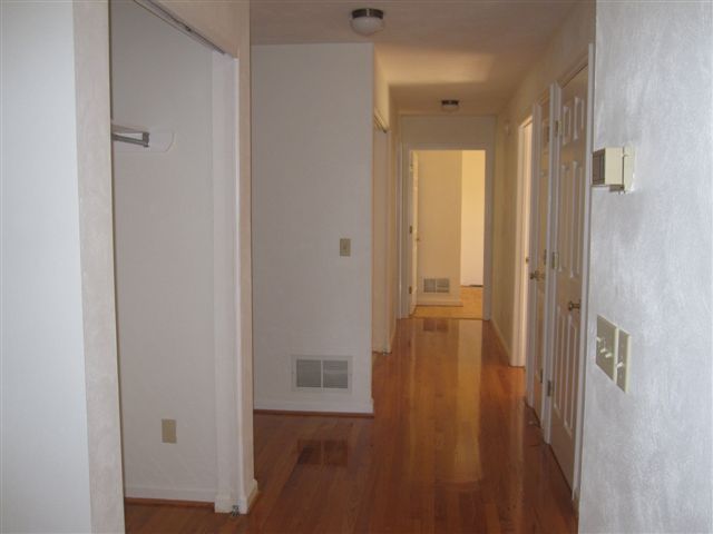 3778 Callaway Road Rocky Mount, VA 24151 - Photo 10 of 28 a view of a hallway with wooden floor