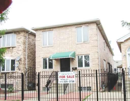a front view of a house with large windows