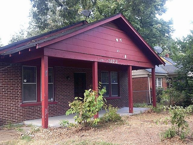 3172 Hoskins Road Memphis, TN 38111 - Photo 1 of 15 View of front of property featuring brick siding and covered porch