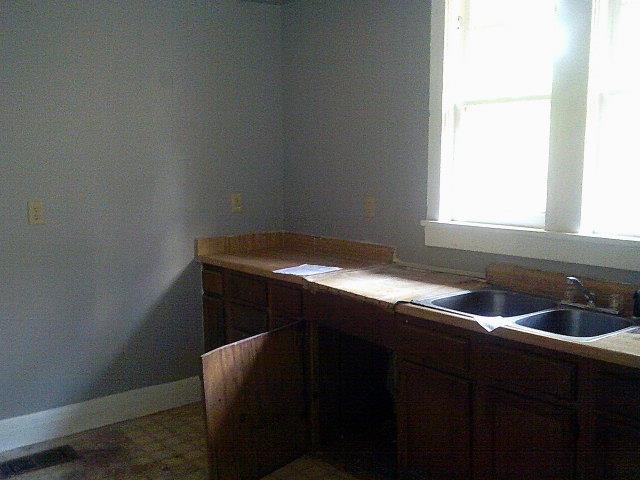 3172 Hoskins Road Memphis, TN 38111 - Photo 13 of 15 Kitchen with a sink and dark brown cabinets