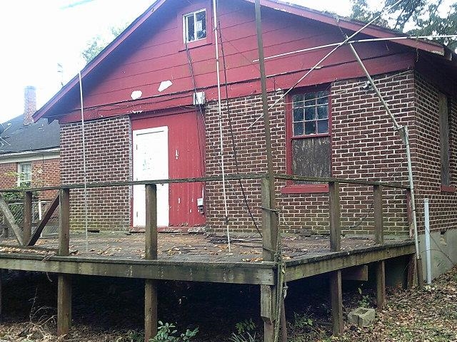 3172 Hoskins Road Memphis, TN 38111 - Photo 3 of 15 View of home's exterior with a wooden deck and brick siding