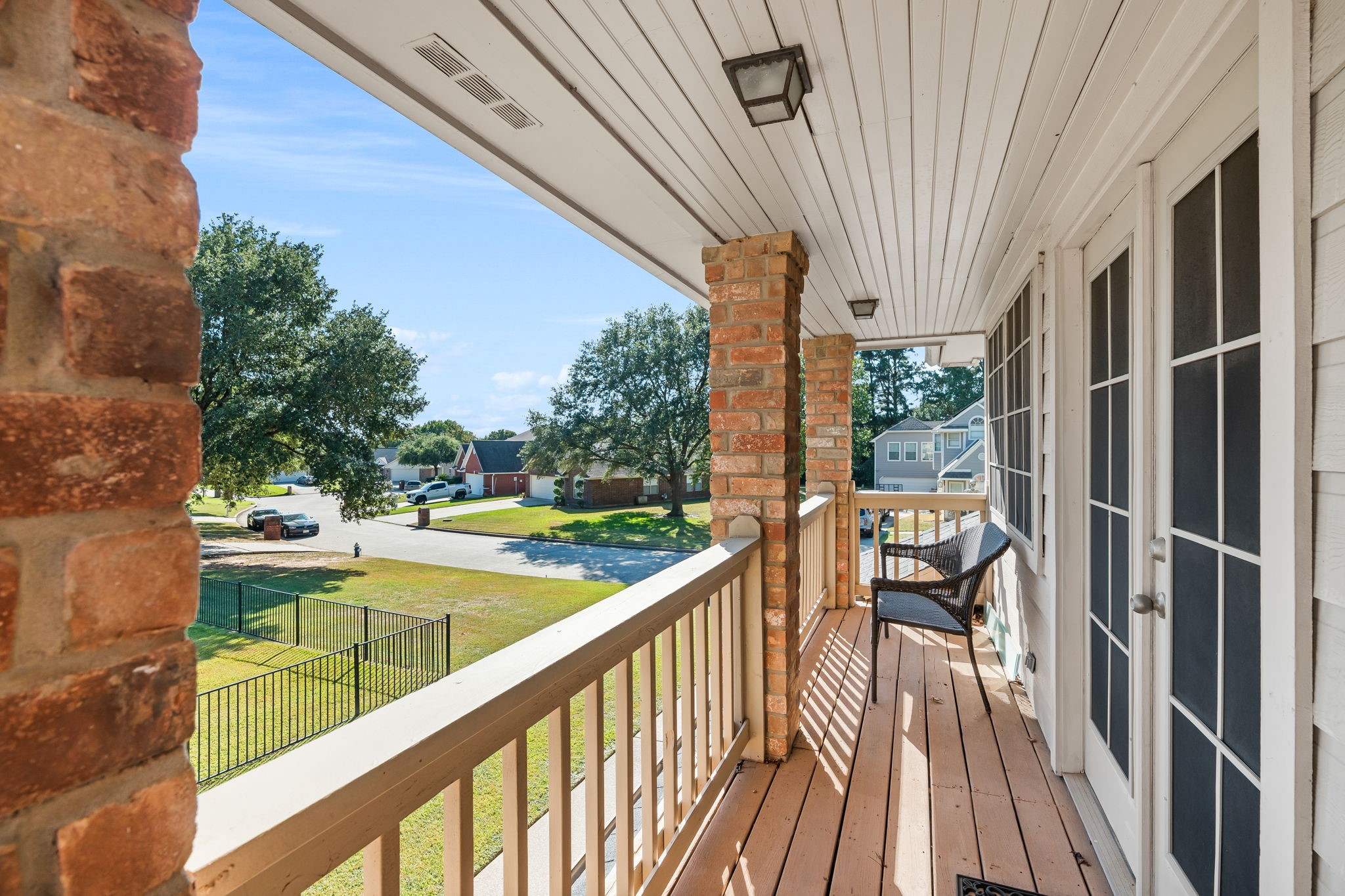 6971 Breezy Point Willis, TX 77318 - Photo 27 of 49 There is a balcony along the side that overlooks the adjoining iron fenced lot that can also be purchased.