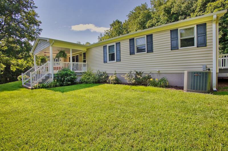 1199 Brammer Spur Road Woolwine, VA 24185 - Photo 1 of 36 a front view of a house with garden