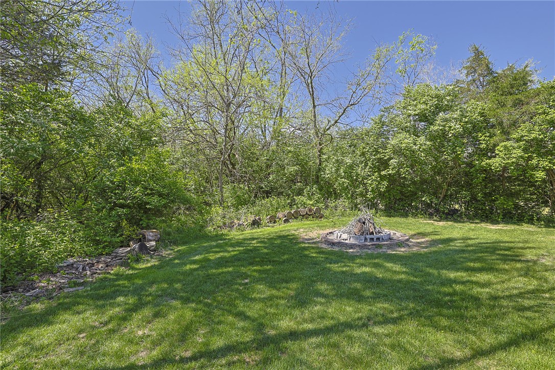 3681 Wilmington Road Lebanon, OH 45036 - Photo 67 of 87 This serene yard features a built-in fire pit, perfect for outdoor gatherings.
