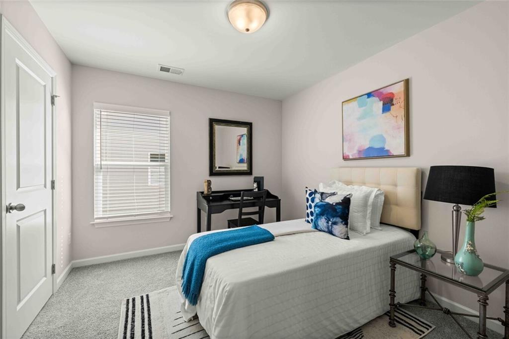 3489 Fairview Road, Unit MAGNOLIA Covington, GA 30016 - Photo 26 of 29 a bedroom with bed and a window