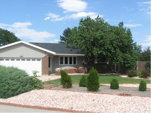 3220 Ward Road Wheat Ridge, CO 80033 - Photo 1 of 1 front view of a house with a yard
